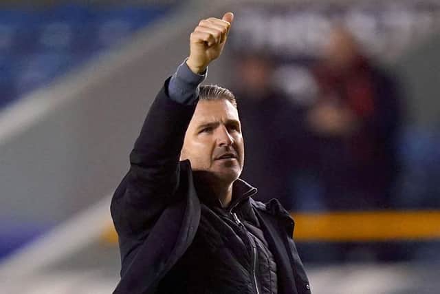Preston North End manager Ryan Lowe waves to the travelling fans at Millwall