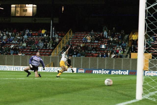 Lee Ashcroft turns to celebrate as his shot travels towards the net in PNE's 4-2 win at Hull City in 1992