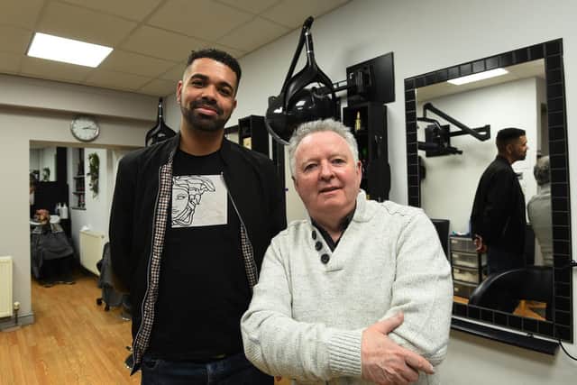 Landlord of the Wellington Inn Jordan Ebbs with proprietor of the hair salon Alan Joyce.