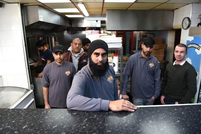 Monior Ashraf and the King Grill Pizza staff