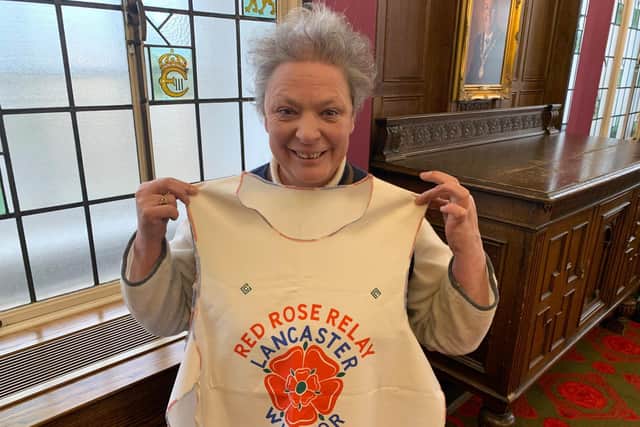 One of her favourites, recently found tucked away in a draw, is a tabard and selection of badges used by participants of the Red Rose Relay (Credit: Lancashire County Council)