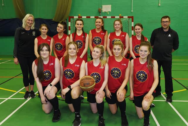 Members of the Under16s Girls Basketball team at Albany Academy, pictured with PE teacher Beth Milburn, left, and coach Chris Walsh, right,