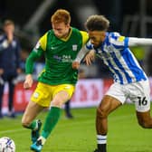 Preston North End's Sepp van den Berg takes on Huddersfield's Sorba Thomas at the John Smith's Stadium last August
