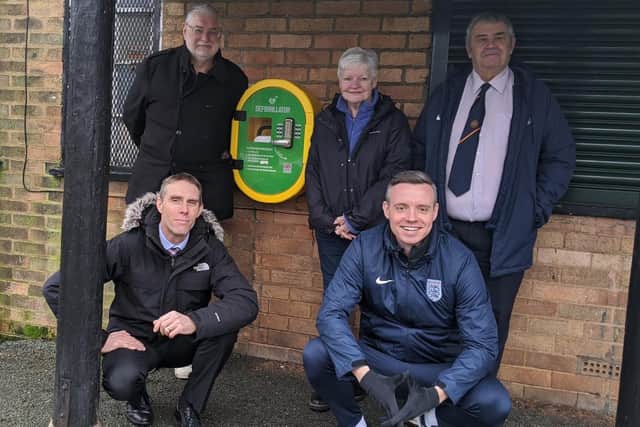 At Moor Park to see a brand new defibrillator fitted were, back from left, Coun Robert Boswell (Cabinet Member for Environment and Community Safety); Coun Jennifer Mein (Cabinet Member for Health and Wellbeing) and Roger Haydock (Chair of Lancashire FA). Front from left, Mark Taylor (Assistant Director, Head of Neighbourhood Services) and Iain Kay (Head of Participation and Development, Lancashire FA). Two further defibrillators have been installed at Ashton Park and Ribbleton Park, with all three major venues for grassroots football