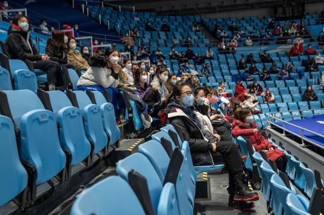 Spectators watch the Men's Single Free Skating Short Program on day four of the Beijing 2022 Winter Olympic Games at Capital Indoor Stadium (Photo by Carl Court/Getty Images)