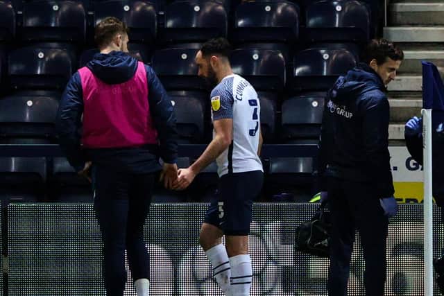 Preston North End defender Greg Cunningham limps off in the first half against Huddersfield Town at Deepdale