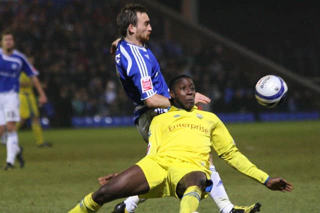 Danny Welbeck is challenged by a Peterborough player on his Prestion North End debut