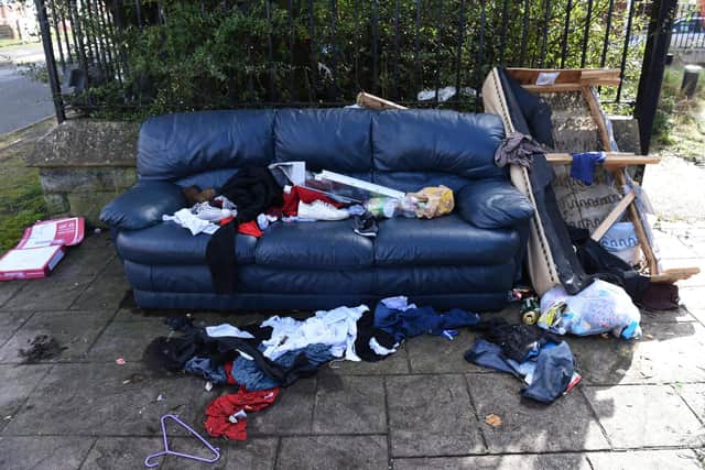 A sofa is also among the piles of rubbish that have been left outside St Andrew's Church.