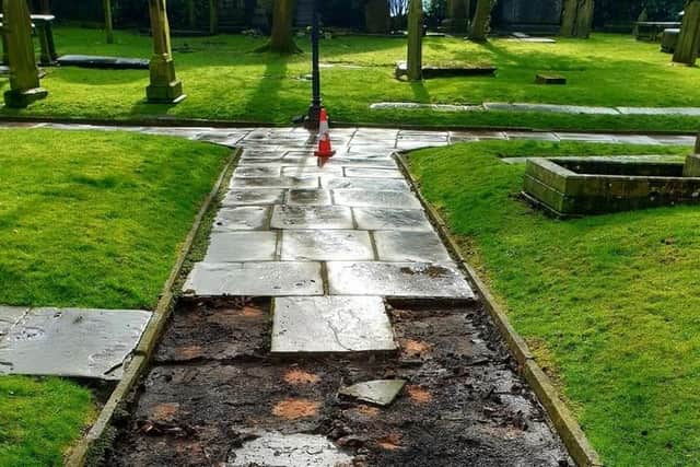 The path at St Mary's and All Saints Church in Whalley where flagstones were ripped up and stolen