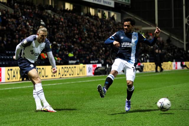 Preston North End’s Brad Potts – who had a passing accuracy of 82.7% from 52 passes – crosses under pressure from Huddersfield Town’s Duane Holmes on Wednesday nigh