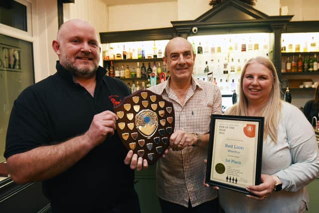 Richard Roberts (left) and Nicola Roberts (right) of The Red Lion with Adrian Smith, chairman of Camra Central Lancs