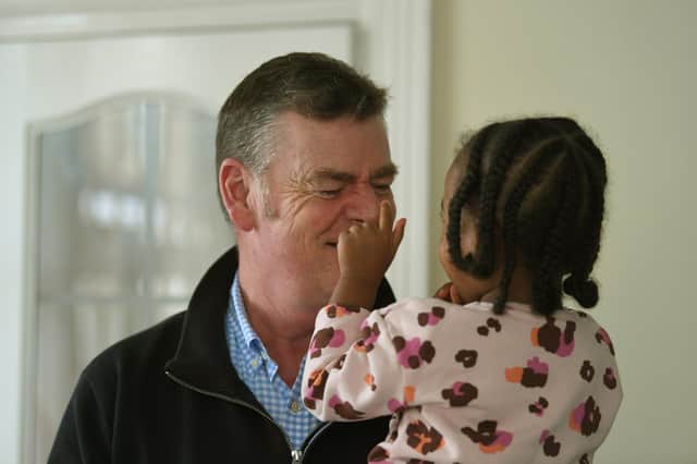 Andy Brown with one of his foster children