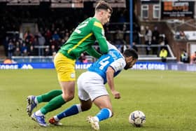 North End’s Josh Earl battling with Peterborough United’s Nathan Thompson