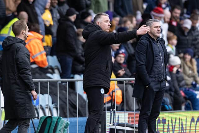 Peterborough manager Darren Ferguson and PNE boss Ryan Lowe on the touchline at London Road