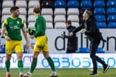 Preston North End manager Ryan Lowe celebrates with the PNE fans after the win at Peterborough United