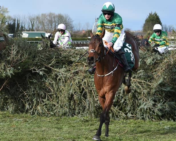 Rachael Blackmore rides Minella Times to victory in the Grand National