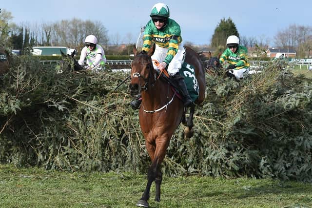 Rachael Blackmore rides Minella Times to victory in the Grand National