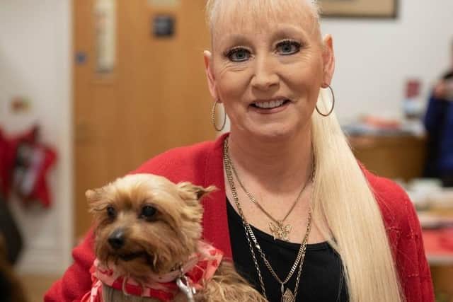 Karena Kirk-Drain with her Yorkshire Terrier, Bella - the dog detected breast cancer and Karena said she owes her life to her pet