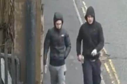Do you recognise these two men? Police want to speak to them after a stabbing in Highfield Road, Blackburn (Credit: Lancashire Police)