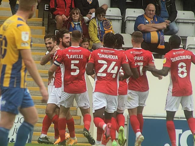 Morecambe celebrate Cole Stockton's goal during last August's win against Shrewsbury Town