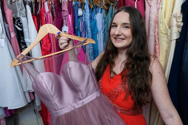 Jennifer Donaldson shows off some of the dresses which will be on sale at the pop up shop   Photo: Kelvin Stuttard