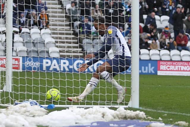Daniel Johnson picks the ball out of the net after scoring PNE's first goal against Reading