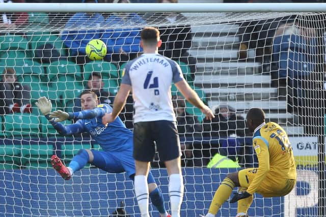 PNE goalkeeper Daniel Iversen makes a fine save from Reading striker Lucas Joao