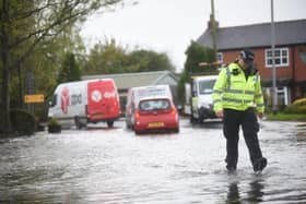 Scenes of flooding in Lancashire in early November last year, which forced police to close roads across the county