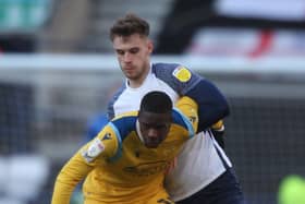 Preston North End centre-half Liam Lindsay battles with Reading’s Lucas Joao at Deepdale