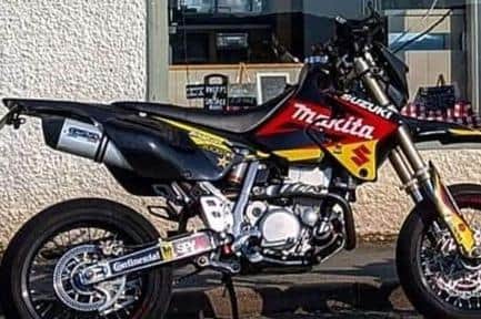 The offenders stole a blue and white Suzuki DRZ400 SM K7 with the registration plate LX58 BXO (Credit: Lancashire Police)