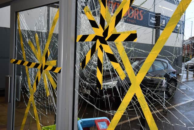Damaged window and door at Barnardo's donation centre and shop on Blackpool Road, Preston  Photo: Neil Cross