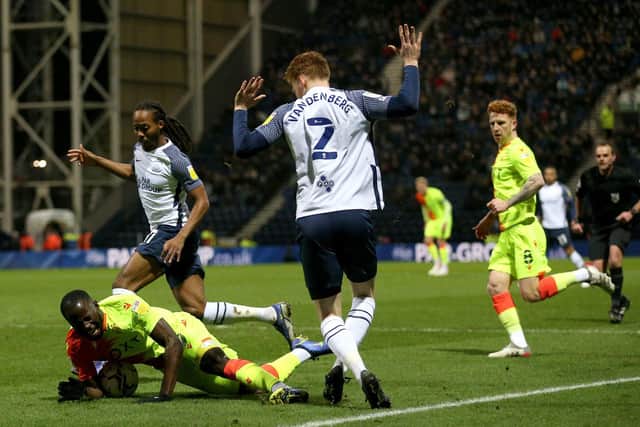 North End's Sepp van den Berg protests his innocence as Nottingham Forest striker Keinan Davis claims a penalty at Deepdale