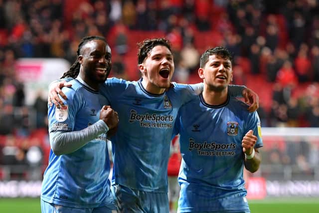 Fankaty Dabo (left), Callum O'Hare and Gustavo Hamer celebrate Coventry City's win over Bristol City.