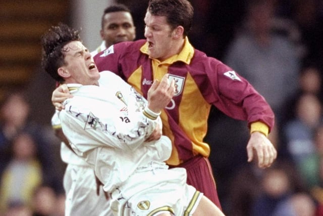 Bradford City striker Dean Windass clashes with Ian Harte.