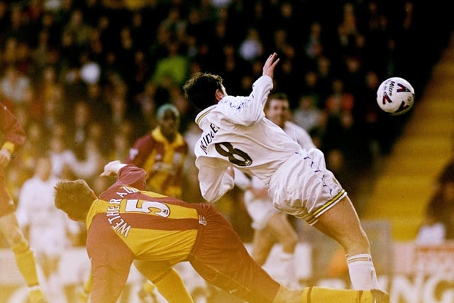 Michael Bridges scores Leeds United's first goal despite the challenge of David Wetherall.
