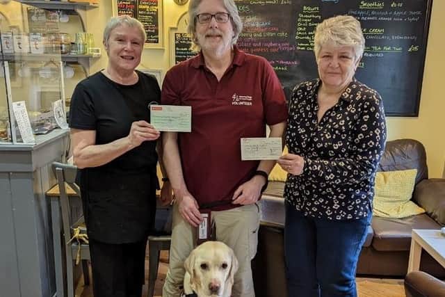 Janet from the Tea Room, Martyn and Kenny (the dog), and Denise Bolton (Charity representative from the Prison Service)