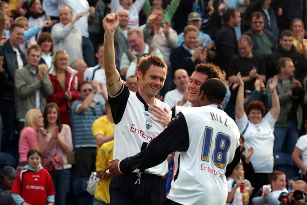 Graham Alexander celebrates with Matt Hill and David Nugent after scoring for PNE from the penalty spot against Sunderland
