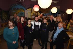 Staff, volunteers and supporters at The Larder celebrating three years in business. Far left is Art @ The Larder coordinator Victoria Dyer, right is volunteer Aimee Johnson, whilst in the middle from left are Elise Bierpierelle, Nik Prescott and Evie Butler from the Larder.