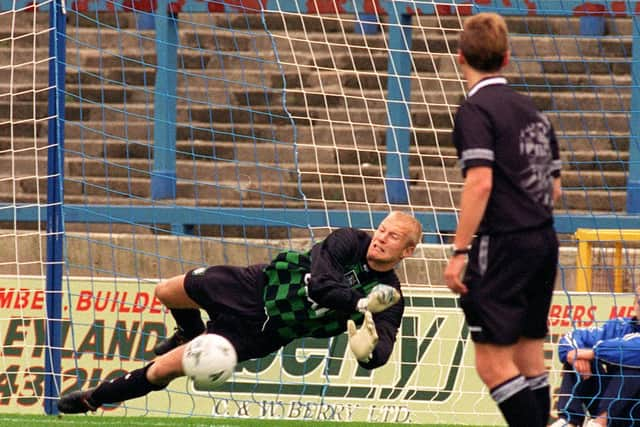 PNE goalkeeper Tepi Moilanen saves a penalty against Brentford