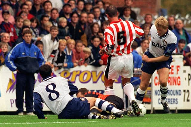 Preston strikers Lee Ashcroft and David Reeves are involved in a goalmouth scramble against Brentford at Deepdale in October 1997