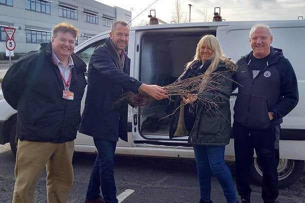 Chorley residents collecting their free tree from Councillor Alistair Bradley - Leader of Chorley Council (second from right) and Councillor Mark Clifford - Champion for Environment and Green Space (left)