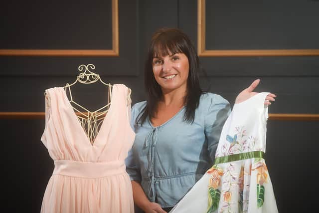 Edyta Ziomek from TropicalEverAfter in Poulton, showing off hand-painted dresses designed by her business partner, Monika Fras (not pictured).