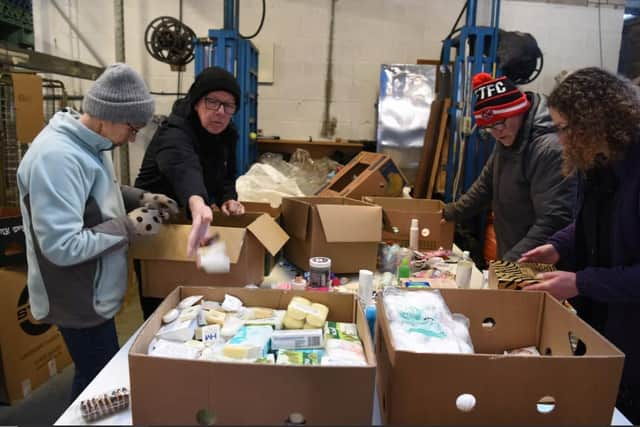 Aid workers in Lostock Hall packing toiletries ready for a 1,900-mile trip to the Moldova-Ukraine border region.