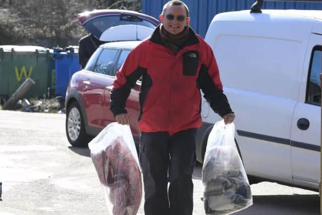 Paul Halton unloads more donations at the International Aid Trust warehouse in Lostock Hall.