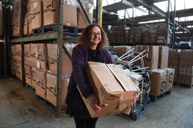 Julie Rowlandson stacking boxes ready for the aid trucks to arrive.