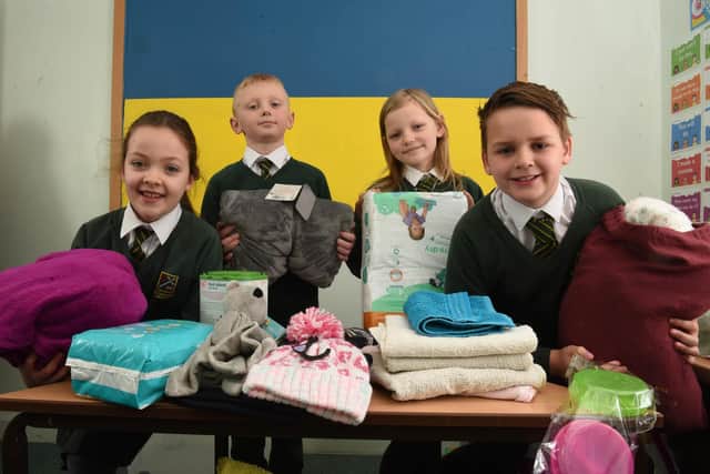 Kate, Artie, Poppy, Tom at St Oswald's Catholic Primary School in Longton with their collection of items to send to Ukrainian refugees (image: Neil Cross)