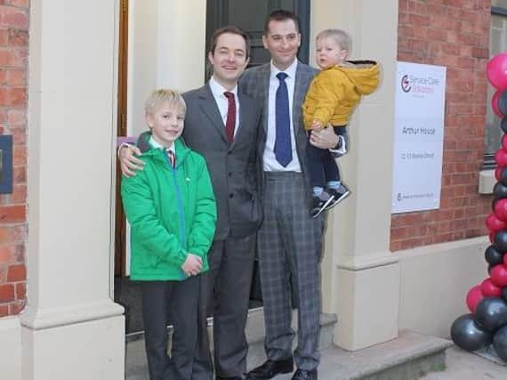 Richard Freye, left, and Chris Musgrove and their young sons