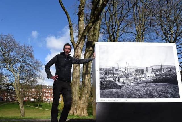 Photographer Garry Cook beside the iconic work of John Davies in Winckley Square
