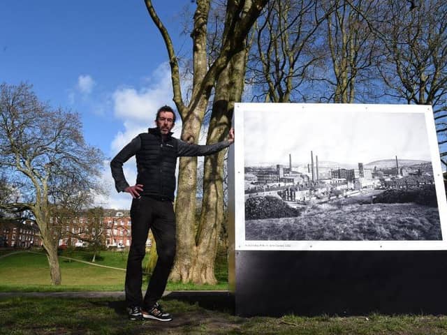 Photographer Garry Cook beside the iconic work of John Davies in Winckley Square