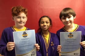 Pupils from Ashton Primary School hold their online safety certificates.